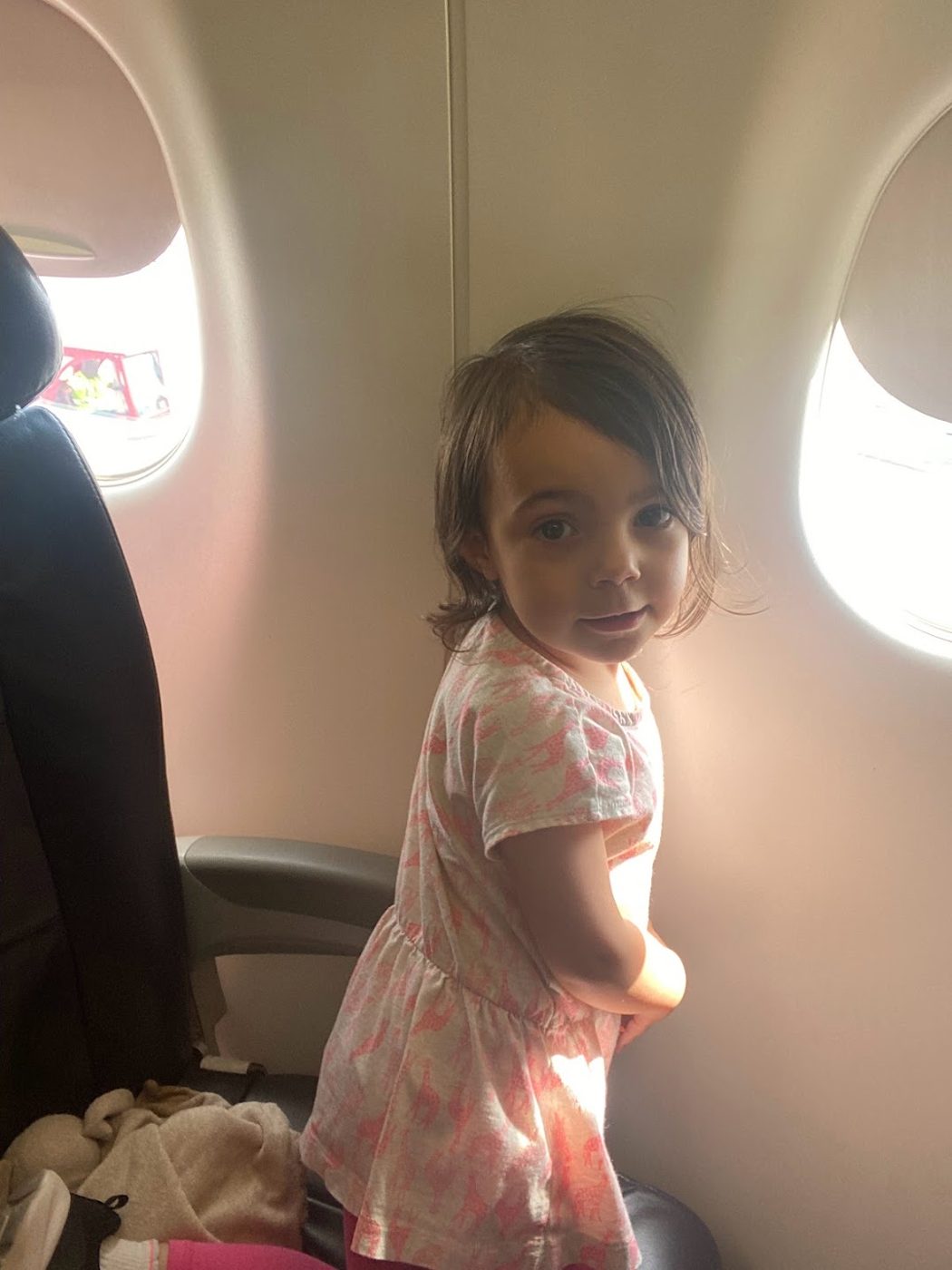 Our youngest, checking out the window seat.